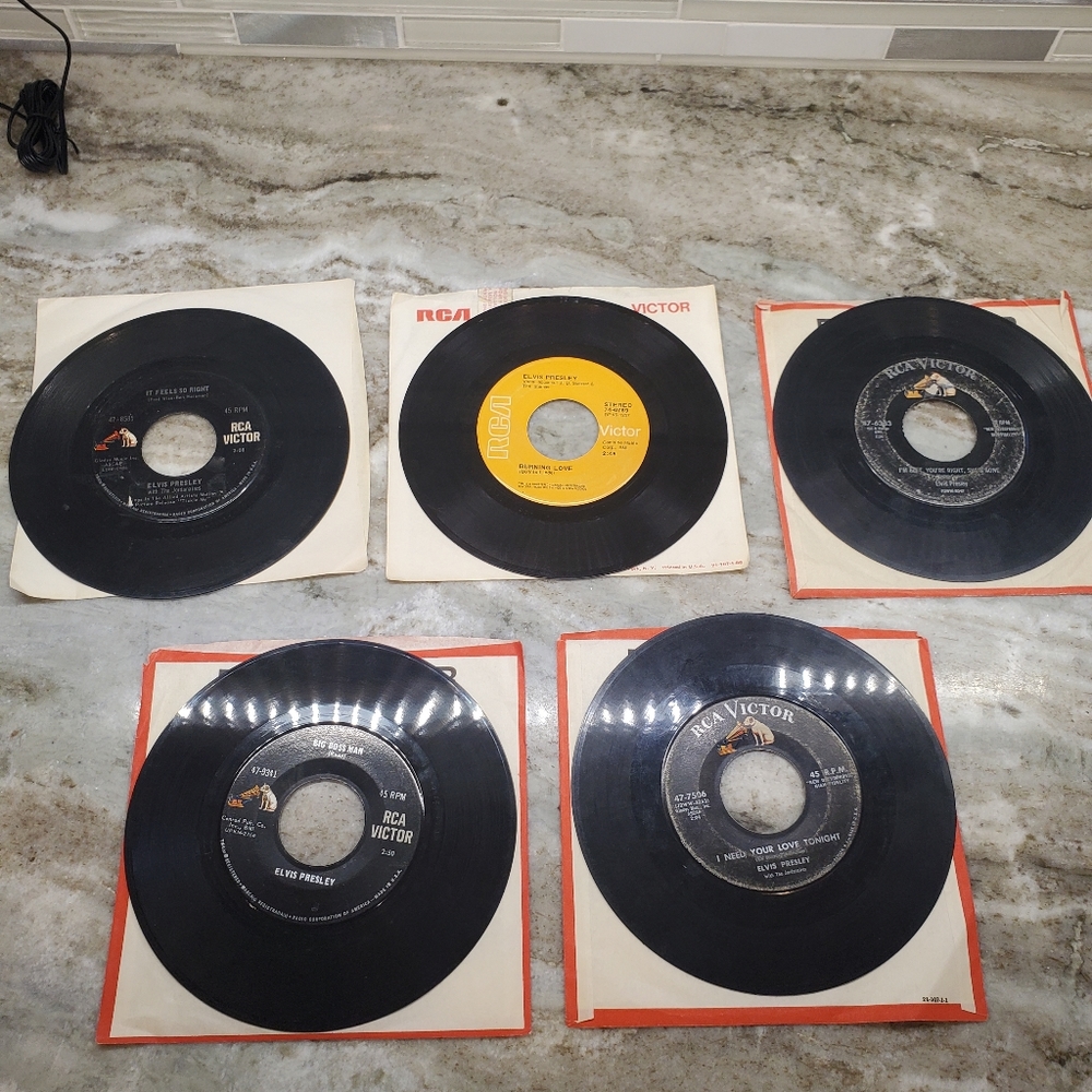 Five Elvis Presley King of Rock And Roll records 45's in the sleeves
